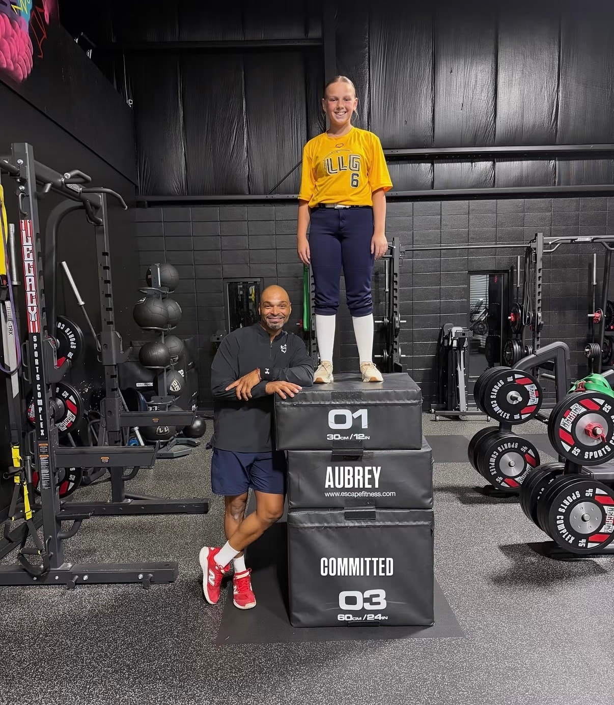 Coach Royce with athlete on plyo boxes at Legacy Sports Complex