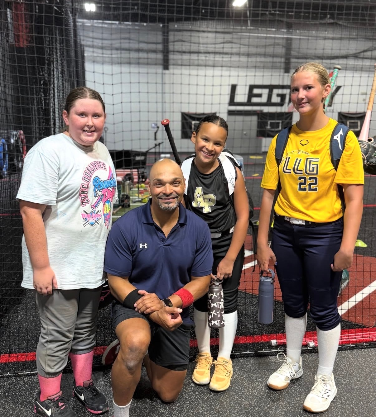 Coach Royce with softball athletes at Legacy Sports Complex Hoschton
